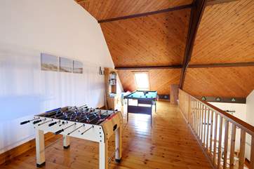 There is a games-area on the mezzanine level.