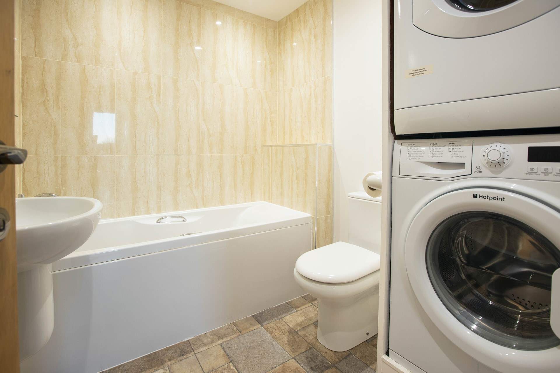 The handy utility room next door to bedroom 1 has a bath with hand-shower attachment.