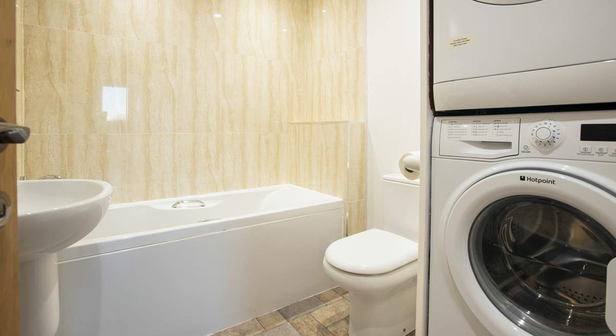 The handy utility room next door to bedroom 1 has a bath with hand-shower attachment.