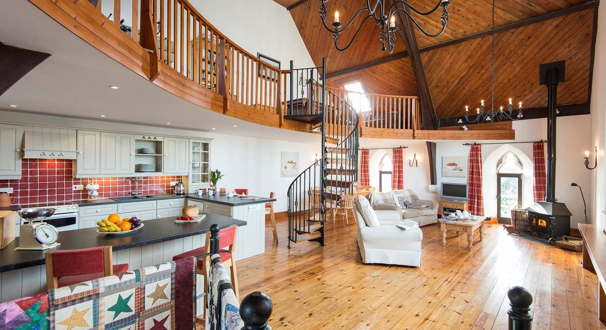 The open plan living-room with kitchen and dining areas.