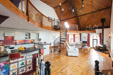 The open plan living-room with kitchen and dining areas.