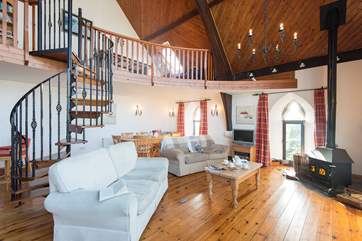 Sofas flank the wood-burner.