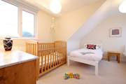 The twin bedroom has a cot should you require.