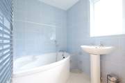 The bathroom with gorgeous corner bath is on the ground floor.