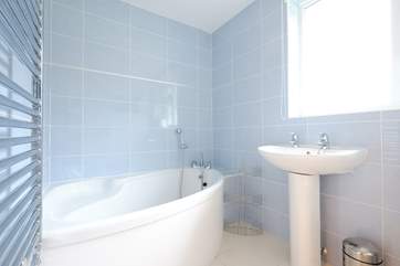 The bathroom with gorgeous corner bath is on the ground floor.
