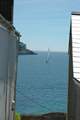 Watch the boats sail by from the property.