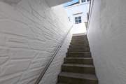 The flight of steps leading up to The Studio from the lane below.