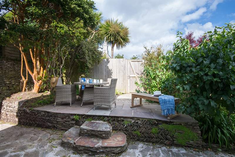 The secluded and sheltered patio is ideal for al fresco dining.