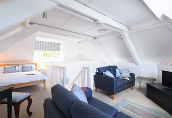 The open plan 'L' shaped bedroom/sitting-area.