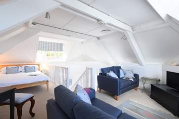The open plan 'L' shaped bedroom/sitting-area.