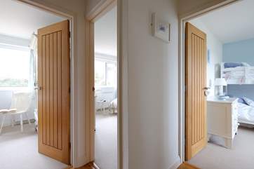 Looking into the bedrooms from the hallway.