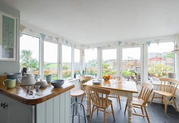 Looking towards the dining-area/conservatory from the kitchen with gorgeous views of the garden.