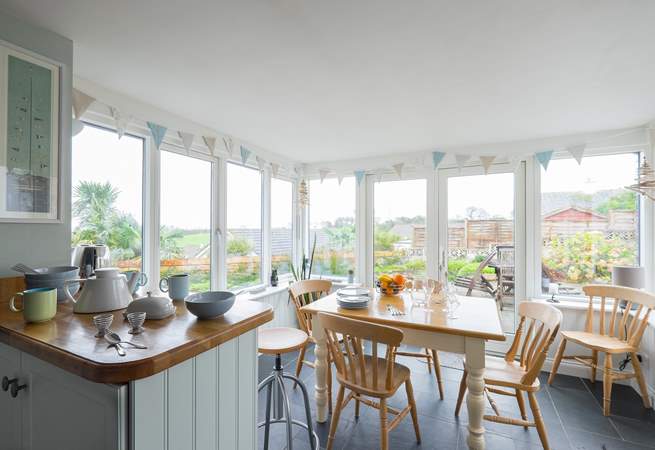 Looking towards the dining-area/conservatory from the kitchen with gorgeous views of the garden.