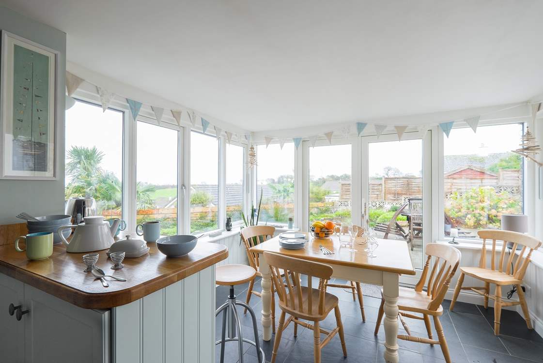Looking towards the dining-area/conservatory from the kitchen with gorgeous views of the garden.