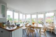 Looking towards the dining-area/conservatory from the kitchen with gorgeous views of the garden.