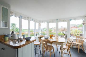 Looking towards the dining-area/conservatory from the kitchen with gorgeous views of the garden.