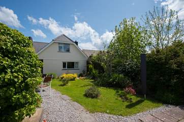 The back garden is secluded and peaceful, perfect for al fresco dining.