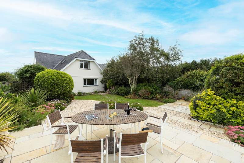 The back garden is secluded and peaceful, perfect for al fresco dining.