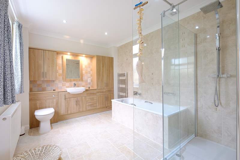 The en suite bathroom for Bedroom 1 with walk in shower and bath for a long soak.