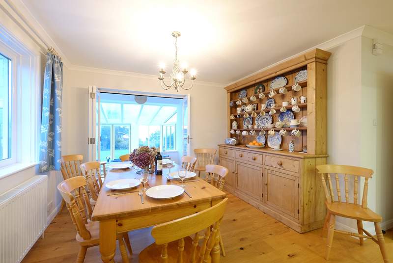 The kitchen has a lovely pine dresser and farmhouse table and chairs.