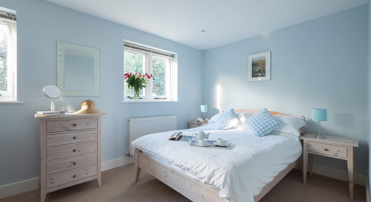 A great night's sleep is assured in the pretty bedroom with king-size bed.