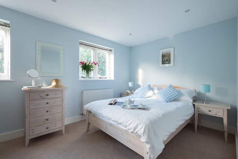 A great night's sleep is assured in the pretty bedroom with king-size bed.