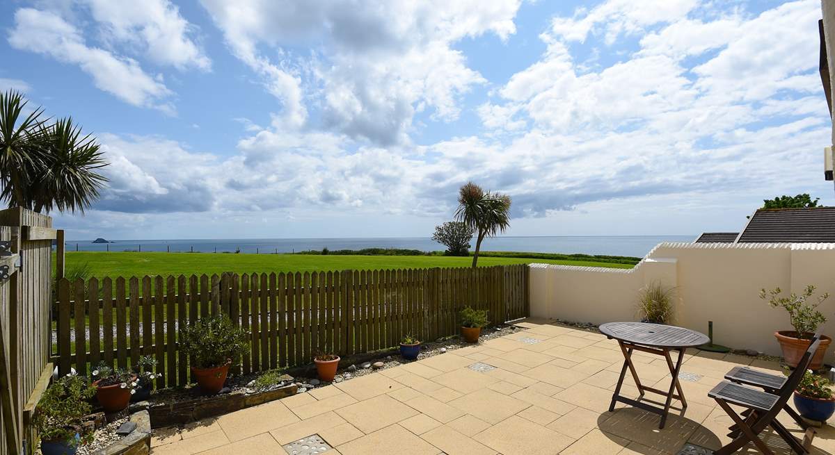 The delightful patio overlooks the surrounding countryside and seascapes.