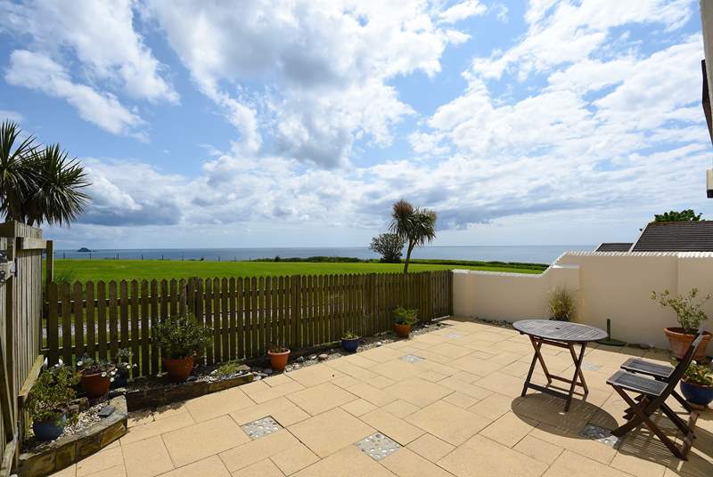 The delightful patio overlooks the surrounding countryside and seascapes.