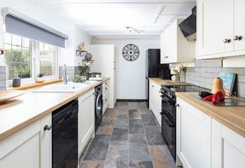 The stylish fully equipped kitchen has everything you need to rustle up a delicious meal.