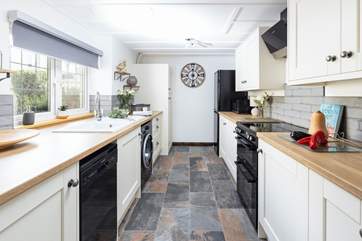 The stylish fully equipped kitchen has everything you need to rustle up a delicious meal.