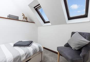 The Velux windows allow the room to flood with light. 