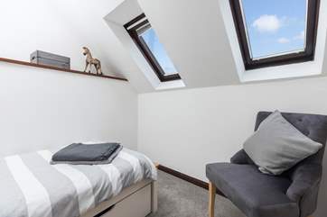 The Velux windows allow the room to flood with light.