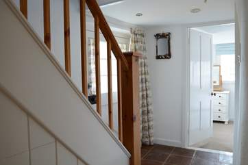 The ground floor dual-aspect bedroom is off the hallway, there is a small step down into the room.
