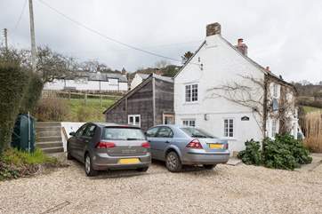 There is space for two cars (one large and one small) beside the cottage, the large area in the foreground is owned by the neighbour and is for turning purposes only for guests of Dairy Cottage.