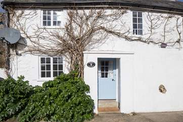 Two steps lead up into this cottage, the back door leads into the boot-room.