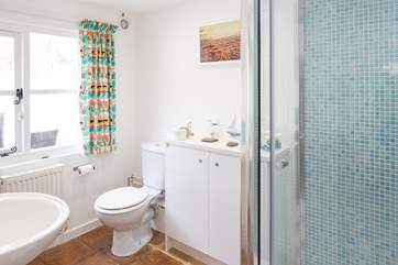 The ground floor bathroom has a double shower cubicle with drench shower and macerator WC.