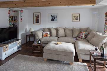 Step down into the comfy sitting-room, and if you are lucky enough to be tall, watch out for the low beam.