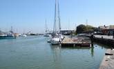 The nearby marina is a lovely place to marvel at the yachts and people watch. - Thumbnail Image