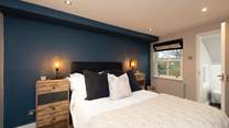 The second bedroom has a comfy double bed and en suite bathroom.