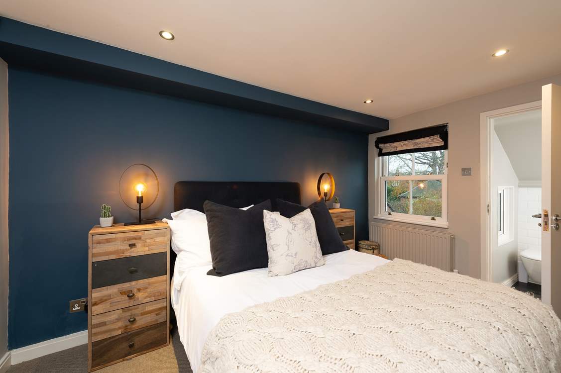 The second bedroom has a comfy double bed and en suite bathroom.