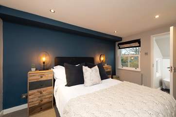 The second bedroom has a comfy double bed and en suite bathroom.