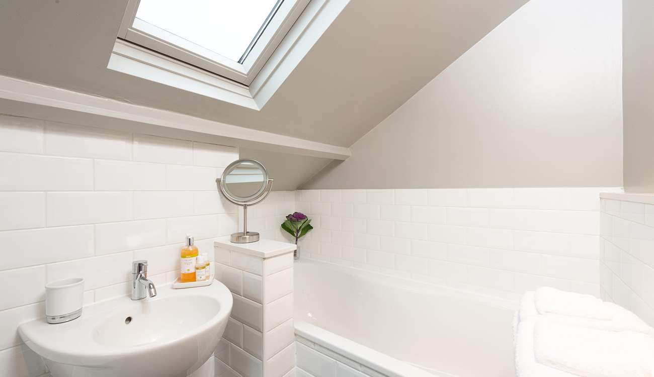 The en suite bathroom has a hand shower attachment, and REN products invite you to luxuriate in the bath.