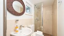 The ground floor shower-room has a large shower with drench head, perfect after a trip to the beach or a day spent sailing.