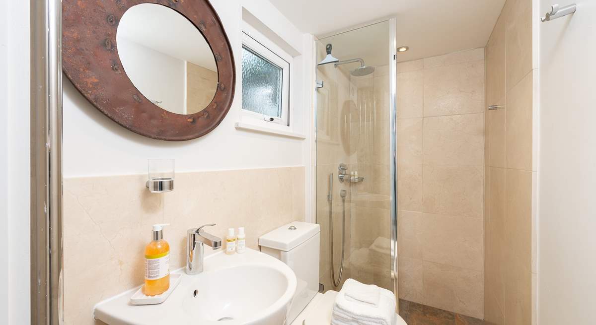 The ground floor shower-room has a large shower with drench head, perfect after a trip to the beach or a day spent sailing.