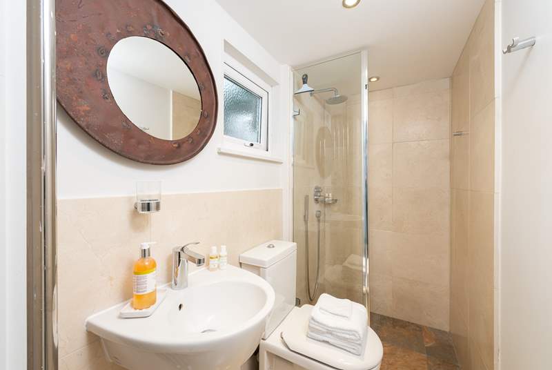 The ground floor shower-room has a large shower with drench head, perfect after a trip to the beach or a day spent sailing.