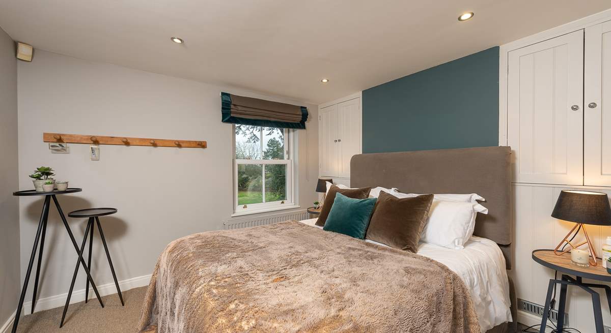 The master bedroom has a super comfy 5ft bed, with luxurious goose down duvet, pillows, and river views.