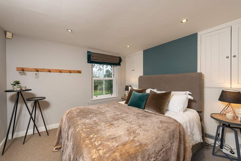 The master bedroom has a super comfy 5ft bed, with luxurious goose down duvet, pillows, and river views.