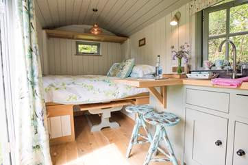 The bed pulls down very cleverly, fully made up and ready to go.