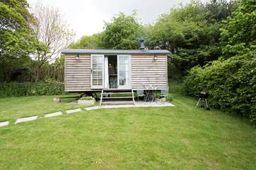 Sheltered by a hedge to the back and side, this is a lovely spot.