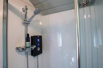 With a hot shower, proper flushing toilet and wash-basin.